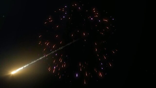 Bright meteor falling through dark space. Glowing comet trail streaking across night sky.
