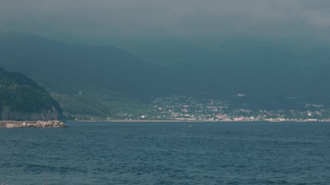 Distant Cityscape Across the Bay Viewed from an Inlet