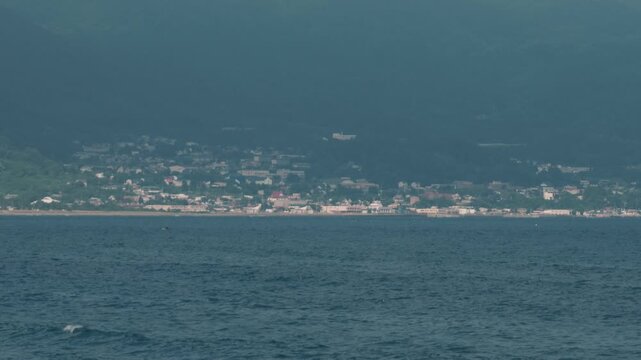 Distant Cityscape Across the Bay Viewed from an Inlet