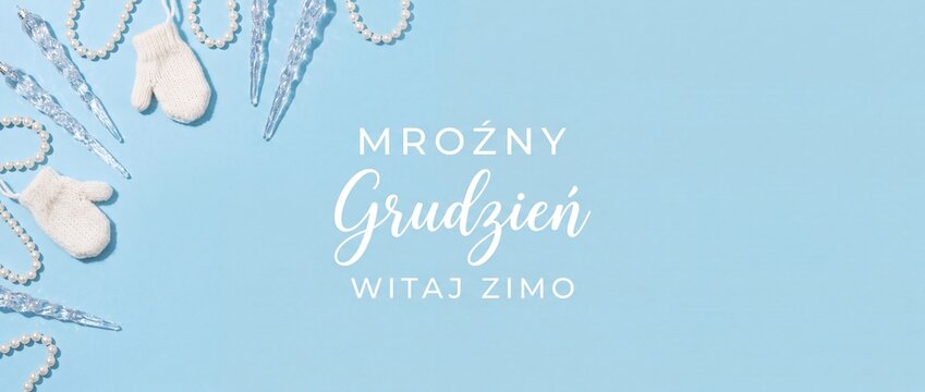 Winter background blue banner with mittens, icicles and Polish text 'Mroźny Grudzień Witaj Zimo' for December holiday greeting card, flat lay flatlay design with copy space for Christmas season.