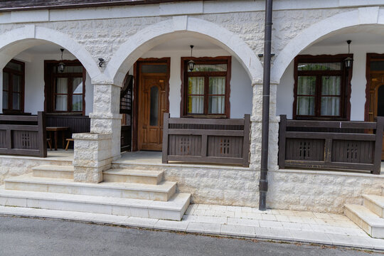 Serbia Mokra Gora 26.05.2026 Stone Archway House Facade Wooden Veranda