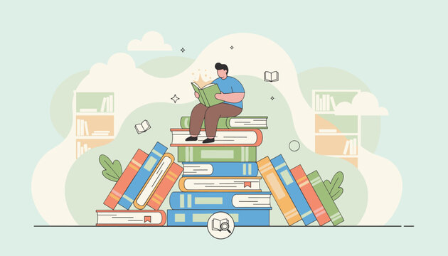Young man sitting on top of a large stack of books and reading a story in a cozy warm library background.