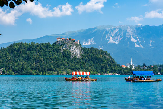 Slovenia, boats on the Lake Bled with in the background the castle.