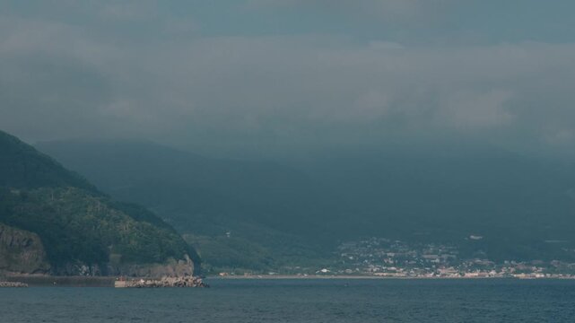 Distant Cityscape Across the Bay Viewed from an Inlet