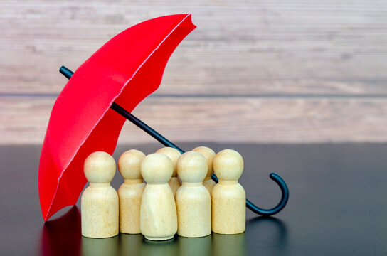 Red umbrella sheltering a group of followers representing strong leadership, protection, and organizational security.