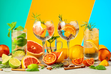 Obraz premium Refreshing summer cocktails with ingredients on a bright colorful background.