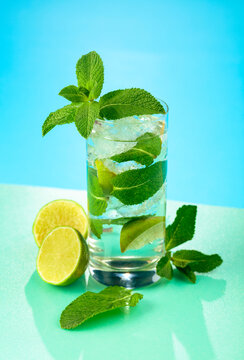 Mojito cocktail with ice, lime and mint.