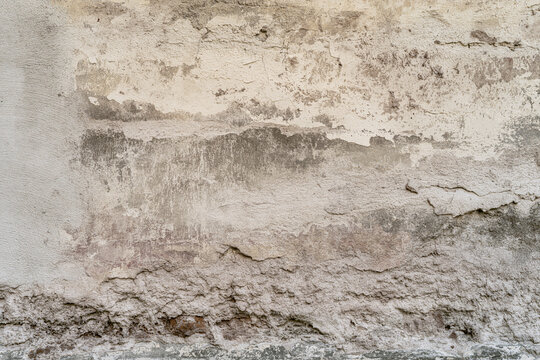 damaged antique concrete wall texture with exposed aggregate