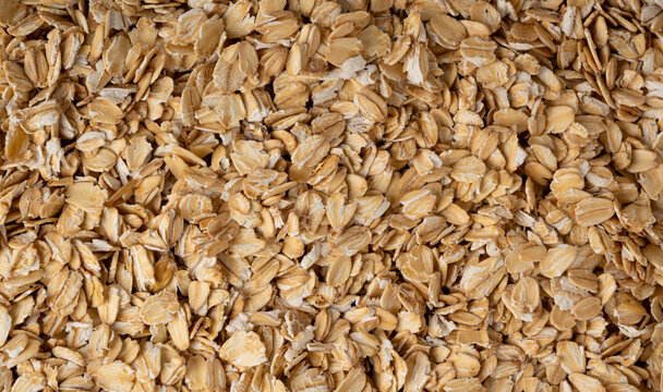 Oat flakes textured pattern, rolled oatmeal macro background