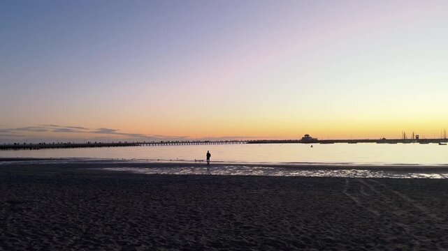 Silhouetted St Kilda Pier at sunset on Port Phillip Bay, Melbourne