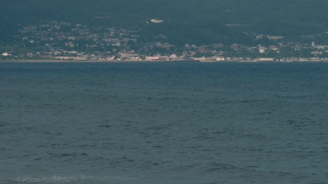 Distant Cityscape Across the Bay Viewed from an Inlet