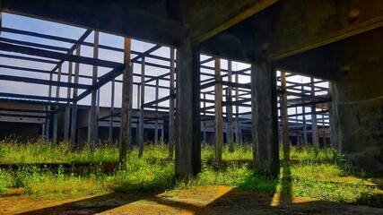 Fototapeta premium Abandoned Industrial Building Interior With Concrete Frame