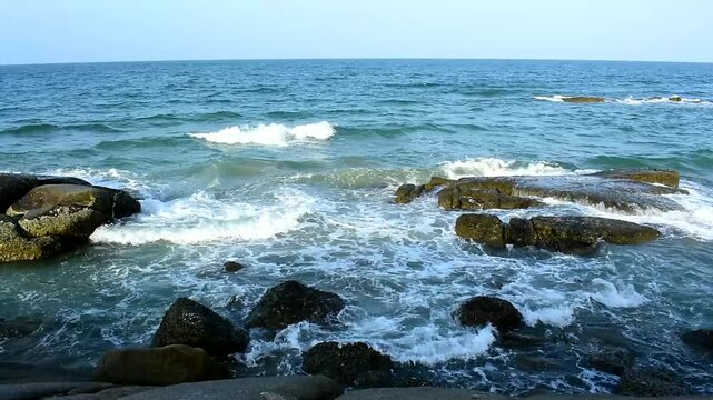 The seaside has sandy beaches and strong waves.