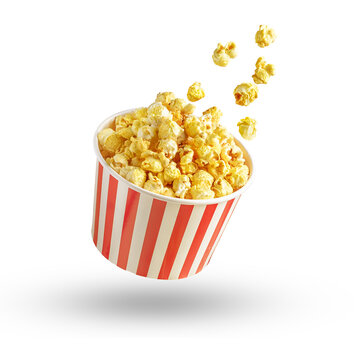 Popcorn in red and white striped bucket and flying out grains isolated on white or transparent background