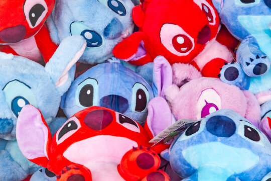 Frankfurt, Germany - May 15, 2026: Pile of plush toys of Stitch and Leroy characters from Disney Lilo and Stitch cartoon at a fairground stall