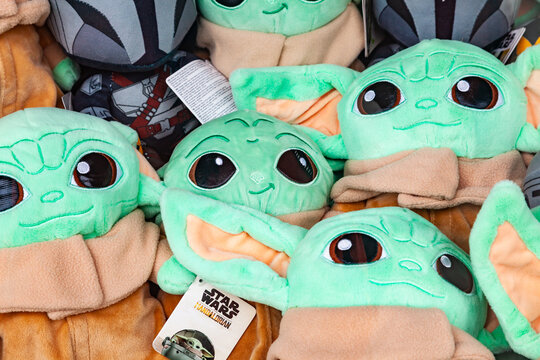 Frankfurt, Germany - May 15, 2026: Pile of plush toys of Grogu Baby Yoda from Star Wars The Mandalorian series with labels at a fairground stall