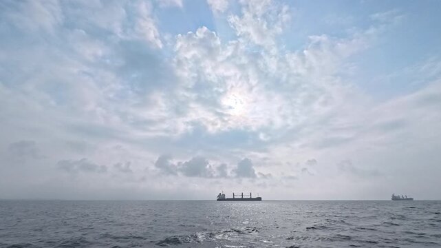Global trade and shipping logistics background footage with majestic cloudy sky and navigation vessels