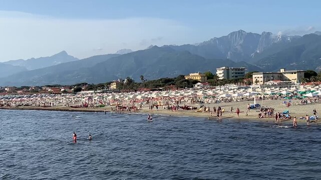 Tuscany coast panoramic view coastline with beautiful sand beaches at sunny day, Lido di Camaiore, Lucca, Italy.	