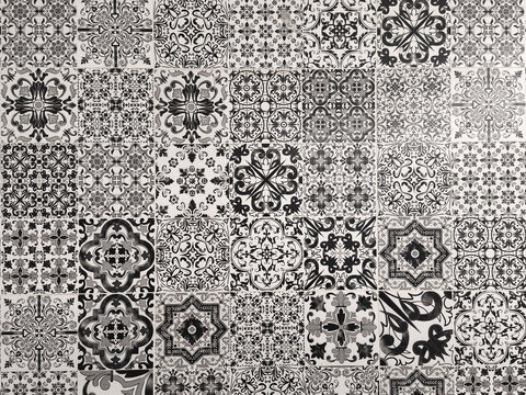 Texture of classic monochrome black and white tegel motif floor ceramic tiles with various geometric floral patterns