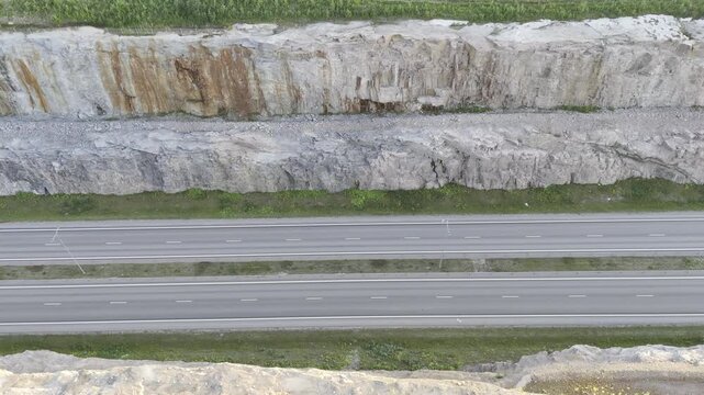 Right Lateral Drone Flight Along Highway Rock Cut, Finland