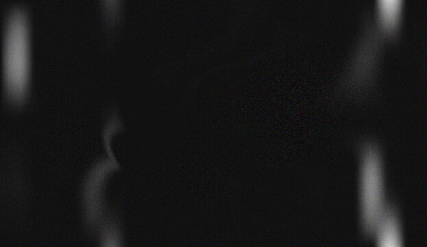 Minimalist dark deep space featuring subtle streaks of light and shimmering digital static creating an enigmatic aura