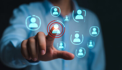 Fototapeta premium Human hand touching digital virtual network connection interface with human icons.
