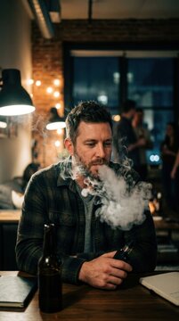 Man Vaping in a Cozy Bar Setting with Warm Lighting.