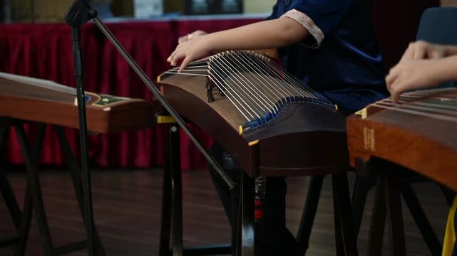 High School Students Playing Gu Zheng Traditional Chinese Zither Musical Instrument in Music Class, Cultural Education and Musicians Rehearsing