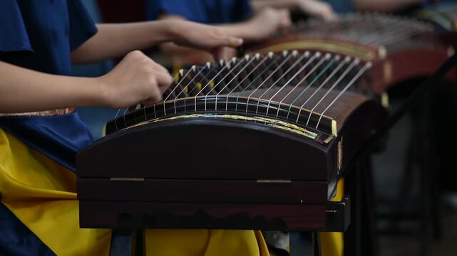 High School Students Playing Gu Zheng Traditional Chinese Zither Musical Instrument in Music Class, Cultural Education and Musicians Rehearsing