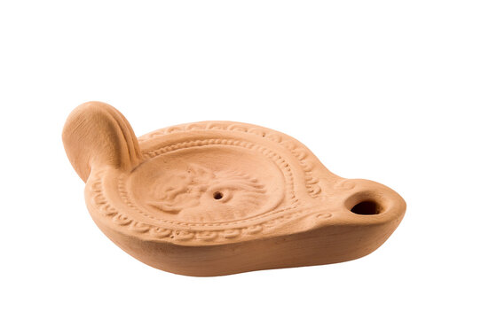 A little Ukrainian oil lamp made in clay, from the town of Chersonesus in Crimea, isolated on white background