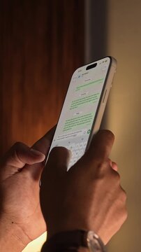 Man hands chatting and typing on smartphone macro closeup. Unrecognizable human typing text message tapping touchscreen keyboard using whatsapp application a social media