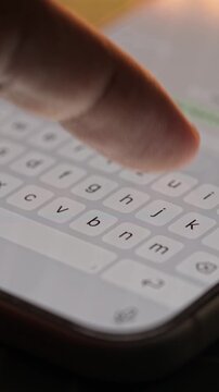 Man hands chatting and typing on smartphone macro closeup. Unrecognizable human typing text message tapping touchscreen keyboard using whatsapp application a social media