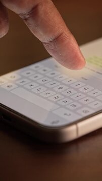 Man hands chatting and typing on smartphone macro closeup. Unrecognizable human typing text message tapping touchscreen keyboard using whatsapp application a social media