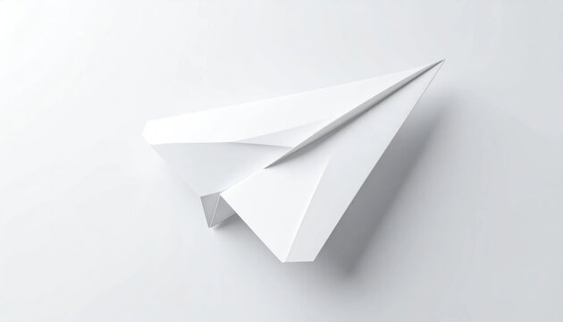Minimalist white paper airplane on clean white background.