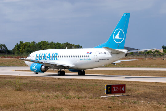 Luqa, Malta - July 14, 2004: Luxair Boeing 737-5C9 (REG: LX-LGP) on taxiway "Charlie" awaiting clearance to backtrack runway 32 for take off.