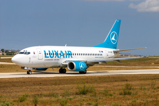 Luqa, Malta - July 14, 2004: Luxair Boeing 737-5C9 (REG: LX-LGP) on taxiway "Charlie" awaiting clearance to backtrack runway 32 for take off.