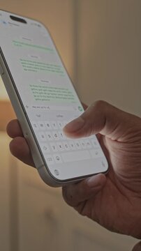 Man hands chatting and typing on smartphone macro closeup. Unrecognizable human typing text message tapping touchscreen keyboard using whatsapp application a social media