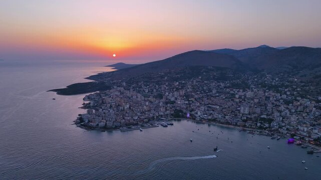 Aerial footage of Saranda at sunset, Albania. Sarand&euml; is a coastal city on the Ionian Sea and the unofficial capital of the Albanian Riviera. 