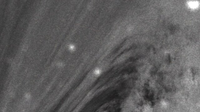 black grey gradient background coronal loops display intense sun activity with bright plasma and magnetic field structures. Suitable for science, space, and astronomical content.