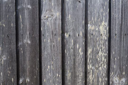 Weathered grey wooden boards with natural weathering texture