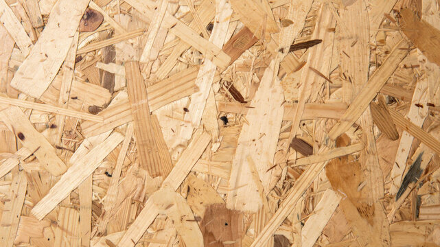 Oriented strand board texture. Wooden particle board background.