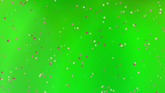 Abstract blurred backdrop with pink confetti dots; vibrant green and yellow gradient background sprinkled with festive pink circles