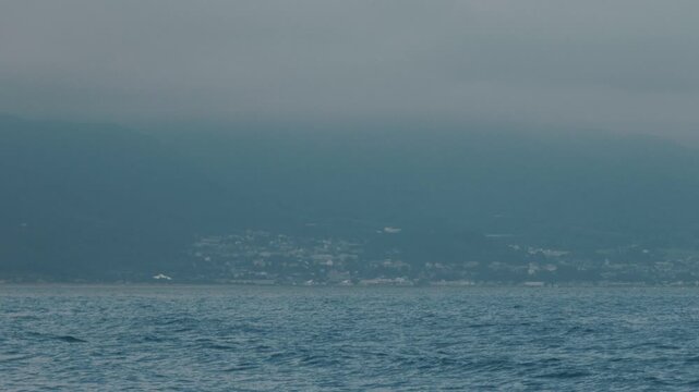 Distant Cityscape Across the Bay Viewed from an Inlet