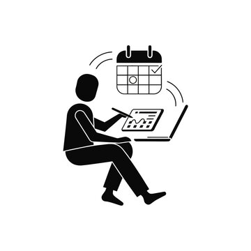 Businessman works on a digital tablet while checking his monthly schedule and project deadlines.