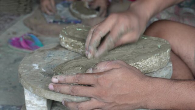 Hands shaping clay with artisan skill