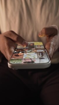 Close-up of scrolling through Instagram Reels, a social media app on a smartphone, depicting digital addiction, mindless browsing, and screen dependency in daily life and prolonged scrolling.
