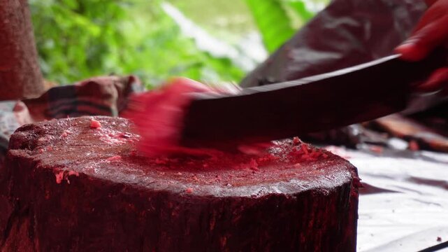 Raw pork meat chopping on rustic wooden block