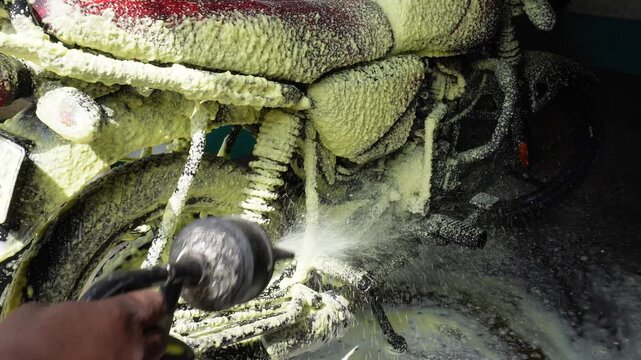 Motorcycle foam wash during professional detailing