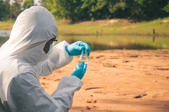 Environmental inspection of river water using advanced laboratory equipment for pollution detection.