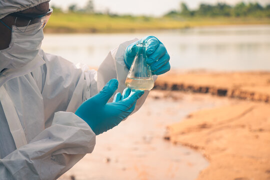 Technician collecting groundwater samples for chemical.